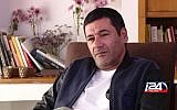 Gilbert Chikli giving an interview in Israel at his Ashdod home, December 29, 2015. (Courtesy of i24 News/ via JTA)