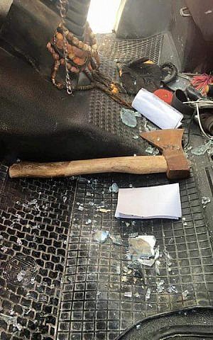 An axe, which was reportedly thrown by an Israeli settler at the windshield of a Palestinian vehicle outside of the Karnei Shomron settlement on February 10, 2016. (Zachria Sadah/Rabbis for Human Rights) An axe, which was reportedly thrown by an Israeli settler at the windshield of a Palestinian vehicle outside of the Karnei Shomron settlement on February 10, 2016. (Zachria Sadah/Rabbis for Human Rights)