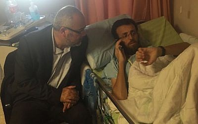 Palestinian hunger striker Mohammed al-Qiq with Joint (Arab) List MK Osama Sa'adi at the Emek Medical Center in Afula, on February 26, 2016. (Courtesy Joint List)