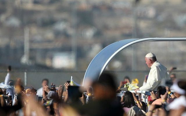 Pope Francis arrives for a massive open-air Mass in a park just a few meters from the US border in Ciudad Juarez, Mexico, Wednesday, Feb. 17, 2016. (AP Photo/Dario Lopez-Mills)