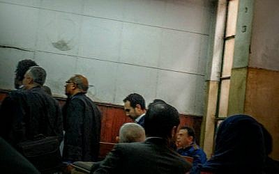 Egyptian author Ahmed Naji, center background, attends a court hearing in Cairo, Egypt, Saturday, Feb. 20, 2016. (AP Photo/Ramy Yaacoub)