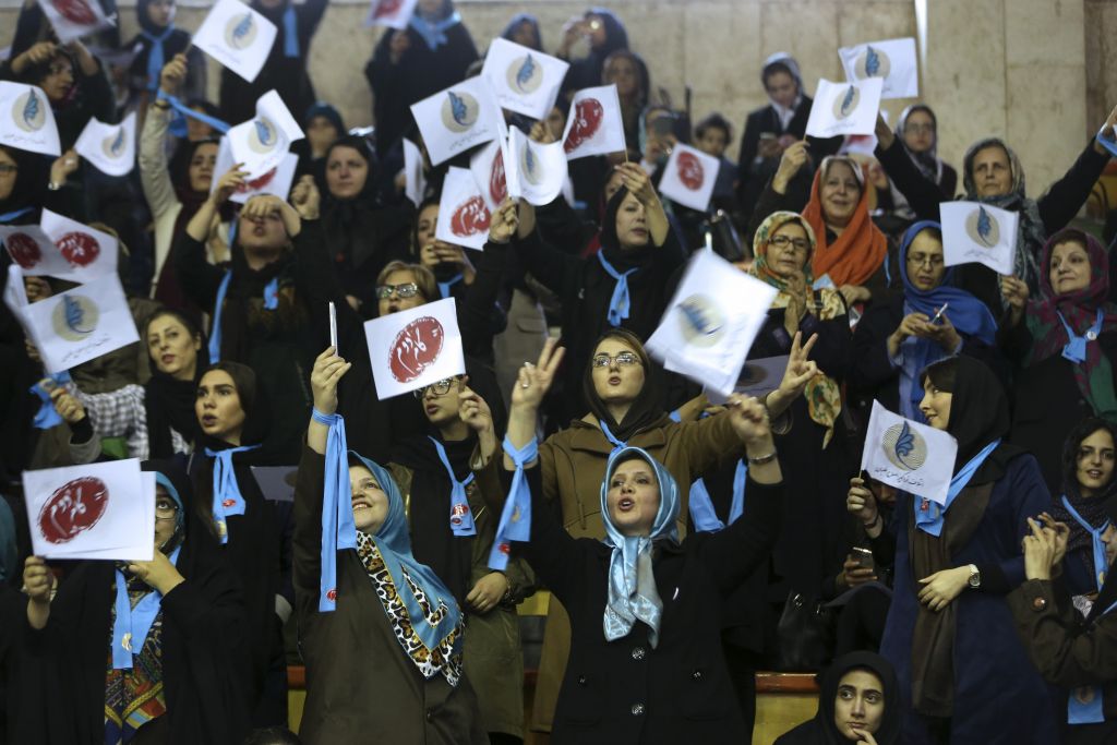 Iranian women cheer as they wave flags of reformists for the parliamentary elections in a campaign rally in Tehran, Iran, Thursday, Feb. 18, 2016. (AP Photo/Vahid Salemi) Iranian women cheer as they wave flags of reformists for the parliamentary elections in a campaign rally in Tehran, Iran, Thursday, Feb. 18, 2016. (AP Photo/Vahid Salemi)