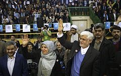 Head of the reformists' coalition list of the Iranian parliamentary elections Mohammad Reza Aref (right) accompanied by his wife, Hamideh, arrive at a campaign rally in Tehran, Iran, February 18, 2016. (AP/Vahid Salemi)