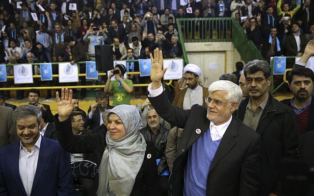 Head of the reformists' coalition list of the Iranian parliamentary elections Mohammad Reza Aref (right) accompanied by his wife, Hamideh, arrive at a campaign rally in Tehran, Iran, February 18, 2016. (AP/Vahid Salemi) Head of the reformists' coalition list of the Iranian parliamentary elections Mohammad Reza Aref (right) accompanied by his wife, Hamideh, arrive at a campaign rally in Tehran, Iran, February 18, 2016. (AP/Vahid Salemi)