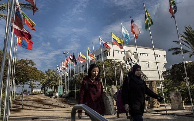 Students walk through the Tel Aviv University campus in Israel. (AP Photo/Tsafrir Abayov)