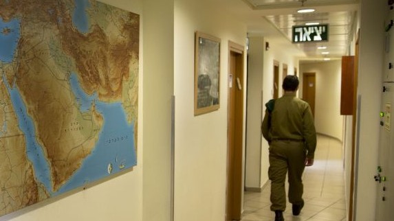 An Israeli soldier walks in an office of the "Roim Rachok" program in downtown Tel Aviv on Feb. 9, 2016. The program provides training and assistance to Israelis on the autism spectrum who wish to enlist in the military (AP Photo/Sebastian Scheiner) An Israeli soldier walks in an office of the "Roim Rachok" program in downtown Tel Aviv on Feb. 9, 2016. The program provides training and assistance to Israelis on the autism spectrum who wish to enlist in the military (AP Photo/Sebastian Scheiner)