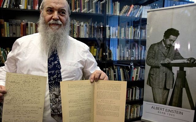 Hebrew University's Roni Gross holds the original historical documents related to Albert Einstein's prediction of the existence of gravitational waves at Hebrew University in Jerusalem, Thursday, Feb. 11, 2016. In a blockbuster announcement, scientists said Thursday that after decades of trying, they have detected gravitational waves, the ripples in the fabric of space-time that Einstein predicted a century ago. (AP Photo/Sebastian Scheiner) Hebrew University's Roni Gross holds the original historical documents related to Albert Einstein's prediction of the existence of gravitational waves at Hebrew University in Jerusalem, Thursday, Feb. 11, 2016. In a blockbuster announcement, scientists said Thursday that after decades of trying, they have detected gravitational waves, the ripples in the fabric of space-time that Einstein predicted a century ago. (AP Photo/Sebastian Scheiner)