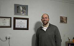 In this Friday, Jan. 29, 2016 photo, Dr. Elan Karten poses for a portrait at his office in Jerusalem. (AP Photo/Tsafrir Abayov)