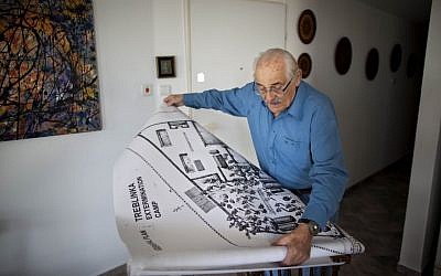 In this October 31, 2010 file photo, Holocaust survivor Samuel Willenberg, who created the Częstochowa memorial, displays a map of Treblinka extermination camp during an interview with the Associated Press in Tel Aviv, Israel. (AP Photo/Oded Balilty, File)