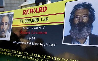 An FBI poster shown in Washington during a news conference shows a composite image of former FBI agent Robert Levinson, right, of how he would look like now, and a photo from a video released by his captors in 2010, left, March 6, 2012. (AP Photo/ Manuel Balce Ceneta, File)
