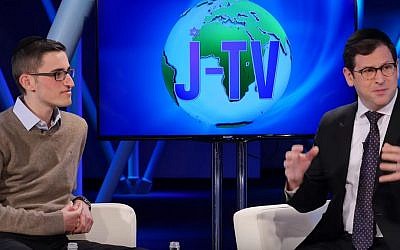 Oliver Anisfeld (left) on the Jewish Wisdom segment on the newly launched J-TV in discussion with Rabbi Shlomo Farhi. (YouTube screenshot)