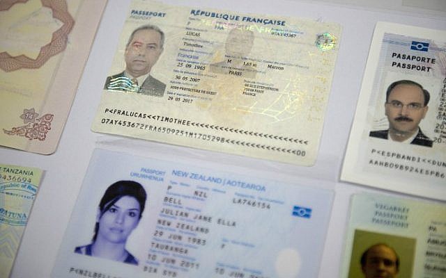 Fake passports are displayed at the immigration bureau in Bangkok on February 10, 2016 after Thai police broke up a major fake passport ring led by an Iranian known as "The Doctor". (NICOLAS ASFOURI / AFP)