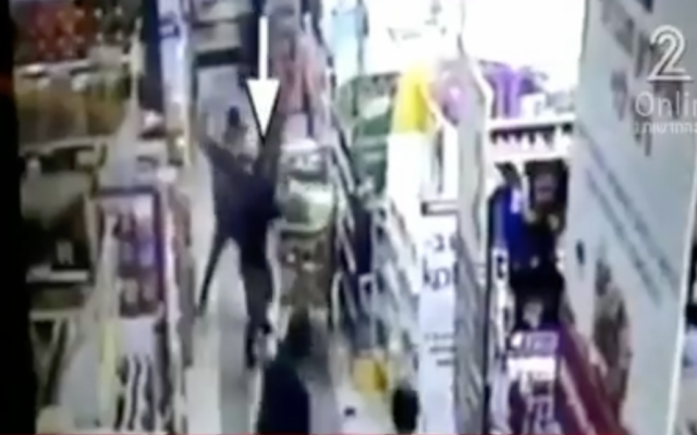 Security camera footage from a deadly stabbing at a West Bank Rami Levy supermarket on February 18, 2016. (screen capture: Channel 2) Security camera footage from a deadly stabbing at a West Bank Rami Levy supermarket on February 18, 2016. (screen capture: Channel 2)