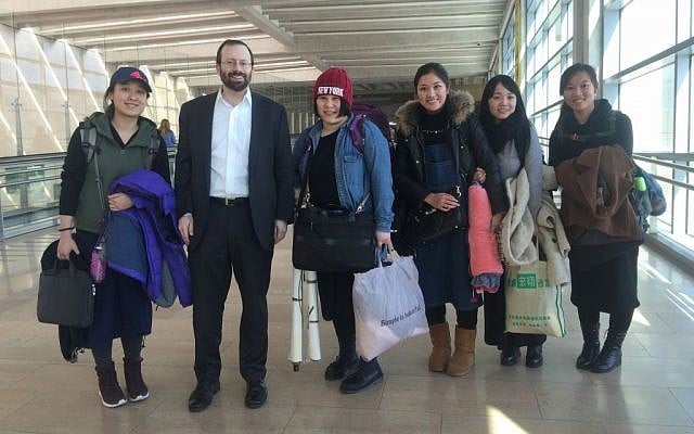 Shavei Israel Founder and Chairman Michael Freund, second from left, greets five women from Kaifeng, China after they arrived at Ben Gurion Airport, Israel, February 29, 2016. (Laura Ben-David/Courtesy of Shavei Israel) Shavei Israel Founder and Chairman Michael Freund, second from left, greets five women from Kaifeng, China after they arrived at Ben Gurion Airport, Israel, February 29, 2016. (Laura Ben-David/Courtesy of Shavei Israel)