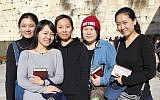 From left to right: Li Yuan, Yue Ting, Li Jing, Li Chengjin and Gao Yichen standing in front of the Western Wall, in the Old City of Jerusalem, February 29, 2016. (Laura Ben-David/Courtesy of Shavei Israel)