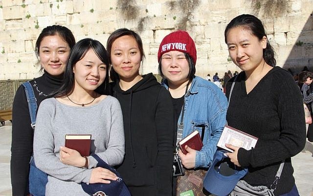 From left to right: Li Yuan, Yue Ting, Li Jing, Li Chengjin and Gao Yichen standing in front of the Western Wall, in the Old City of Jerusalem, February 29, 2016. (Laura Ben-David/Courtesy of Shavei Israel) From left to right: Li Yuan, Yue Ting, Li Jing, Li Chengjin and Gao Yichen standing in front of the Western Wall, in the Old City of Jerusalem, February 29, 2016. (Laura Ben-David/Courtesy of Shavei Israel)
