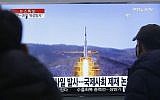 South Koreans watch a TV news program with file footage of North Korea's rocket launch plans, at Seoul Railway Station in Seoul, South Korea, Wednesday, Feb. 3, 2016. (AP Photo/Ahn Young-joon)