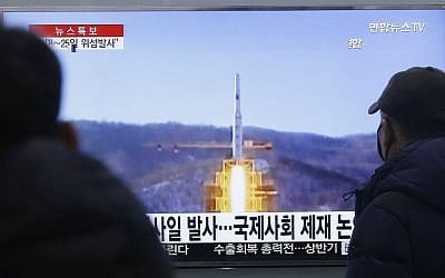 South Koreans watch a TV news program with file footage of North Korea's rocket launch plans, at Seoul Railway Station in Seoul, South Korea, Wednesday, Feb. 3, 2016. (AP Photo/Ahn Young-joon)