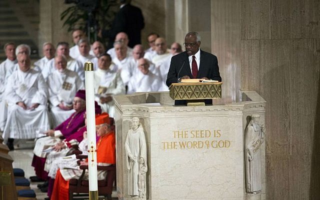 Supreme Court Justice Clarence Thomas reads a passage from the New Testament during the funeral mass for the late Supreme Court Associate Justice Antonin Scalia at the Basilica of the National Shrine of the Immaculate Conception in Washington, Saturday, Feb. 20, 2016. (Doug Mills/The New York Times via AP, Pool) Supreme Court Justice Clarence Thomas reads a passage from the New Testament during the funeral mass for the late Supreme Court Associate Justice Antonin Scalia at the Basilica of the National Shrine of the Immaculate Conception in Washington, Saturday, Feb. 20, 2016. (Doug Mills/The New York Times via AP, Pool)