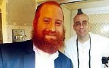 Rabbi Dovid Goldstein, director of Chabad-Lubavitch of West Houston and a chaplain in the Texas prison system, with death-row inmate Jedidiah Murphy, who donned tefillin for the first time to celebrate his bar mitzvah. (Courtesy Chabad.org)
