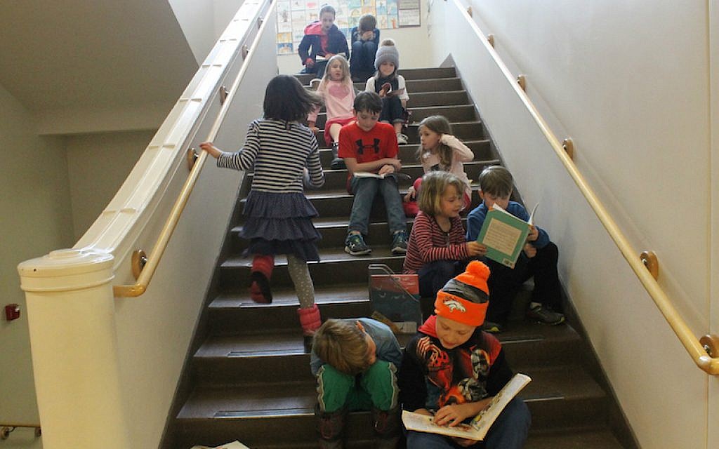 The older students take time out of the day to read stories to younger students at the McGillis School in Salt Lake City, Utah. (Uriel Heilman/JTA) The older students take time out of the day to read stories to younger students at the McGillis School in Salt Lake City, Utah. (Uriel Heilman/JTA)