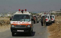 Illustrative: International Red Cross members securing transport for sick Palestinians from Gaza into Israel for medical treatment at the Erez Crossing on June 19, 2007. (Ahmad Khateib/Flash90)