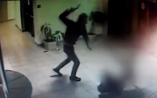 Security camera footage showing Palestinian Saadi Ali Abu Ahmad attacking unarmed security guard Tzvi Cohen with an ax, in a mall in the settlement of Ma'ale Adumim, February 25, 2016. (YouTube/Alik Maor) Security camera footage showing Palestinian Saadi Ali Abu Ahmad attacking unarmed security guard Tzvi Cohen with an ax, in a mall in the settlement of Ma'ale Adumim, February 25, 2016. (YouTube/Alik Maor)
