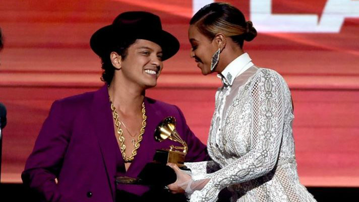 Beyonce presenting Best Record Grammy to Bruno Mars in her Inbal Dror-designed bridal gown (Courtesy Grammy The Recording Academy)