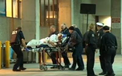 A victim of the Columbus machete attacks is wheeled to a local emergency room on February 11, 2016. (YouTube) 