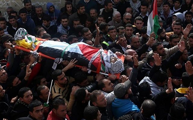 Palestinian mourners carry the body of Amjad Abu Omar Sakari, who was shot dead while carrying out an attack on Israeli soldiers near the Beit El settlement, during his funeral in the village of Jamain south of Nablus, on February 1, 2016. (AFP / JAAFAR ASHTIYEH) Palestinian mourners carry the body of Amjad Abu Omar Sakari, who was shot dead while carrying out an attack on Israeli soldiers near the Beit El settlement, during his funeral in the village of Jamain south of Nablus, on February 1, 2016. (AFP / JAAFAR ASHTIYEH)