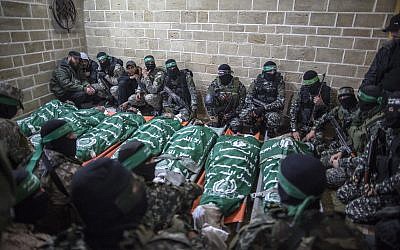 Palestinian fighters from the Izz ad-Din al-Qassam Brigades pray near the bodies of seven colleagues killed while repairing a tunnel, during their funeral at a mosque in Gaza City, on January 29, 2016. Photo by Emad Nassar/Flash90 Palestinian fighters from the Izz ad-Din al-Qassam Brigades pray near the bodies of seven colleagues killed while repairing a tunnel, during their funeral at a mosque in Gaza City, on January 29, 2016. Photo by Emad Nassar/Flash90
