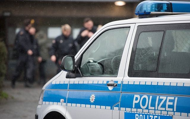 A police car stands outside a refugee shelter on February 4, 2016, in Attendorn after a raid during which a suspect was arrested. (AFP/dpa/Bernd Thissen) A police car stands outside a refugee shelter on February 4, 2016, in Attendorn after a raid during which a suspect was arrested. (AFP/dpa/Bernd Thissen)