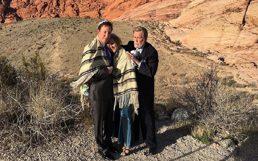Rabbi Mel Hecht marries Craig Silver and Karen Butt of Connecticut at Red Rock Canyon near Las Vegas, Feb. 12, 2016. (Ron Kampeas/JTA) Rabbi Mel Hecht marries Craig Silver and Karen Butt of Connecticut at Red Rock Canyon near Las Vegas, Feb. 12, 2016. (Ron Kampeas/JTA)