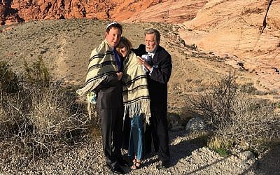 Rabbi Mel Hecht marries Craig Silver and Karen Butt of Connecticut at Red Rock Canyon near Las Vegas, Feb. 12, 2016. (Ron Kampeas/JTA)