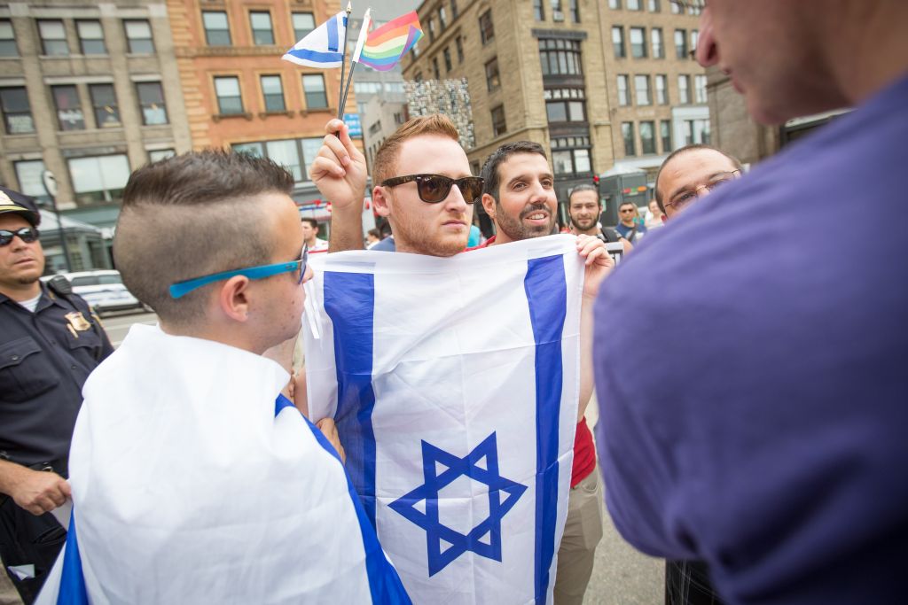 Brett Loewenstern, center with Israeli flag, protested a Palestinian "die-in" event staged on the Boston Common on July 19, 2014. (Elan Kawesch/The Times of Israel) Brett Loewenstern, center with Israeli flag, protested a Palestinian "die-in" event staged on the Boston Common on July 19, 2014. (Elan Kawesch/The Times of Israel)