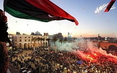 FILE: Thousands of Libyans celebrating the second anniversary of the Libyan uprising at Martyrs square in Tripoli on February 17, 2013. (MAHMUD TURKIA / AFP)