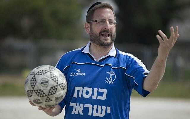MK Dov Lipman in a Knesset jersey during a soccer training near the parliament in Jerusalem, May 13, 2014. (Flash90)