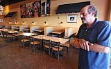 Nazareth restaurant owner Hany Baransi on Friday, Feb. 12, 2016 describes a machete attack the night before in his restaurant in Columbus, Ohio.  (Doral Chenoweth/The Columbus Dispatch via AP)