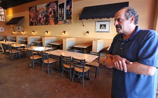 Nazareth restaurant owner Hany Baransi on Friday, Feb. 12, 2016 describes a machete attack the night before in his restaurant in Columbus, Ohio. (Doral Chenoweth/The Columbus Dispatch via AP) Nazareth restaurant owner Hany Baransi on Friday, Feb. 12, 2016 describes a machete attack the night before in his restaurant in Columbus, Ohio. (Doral Chenoweth/The Columbus Dispatch via AP)