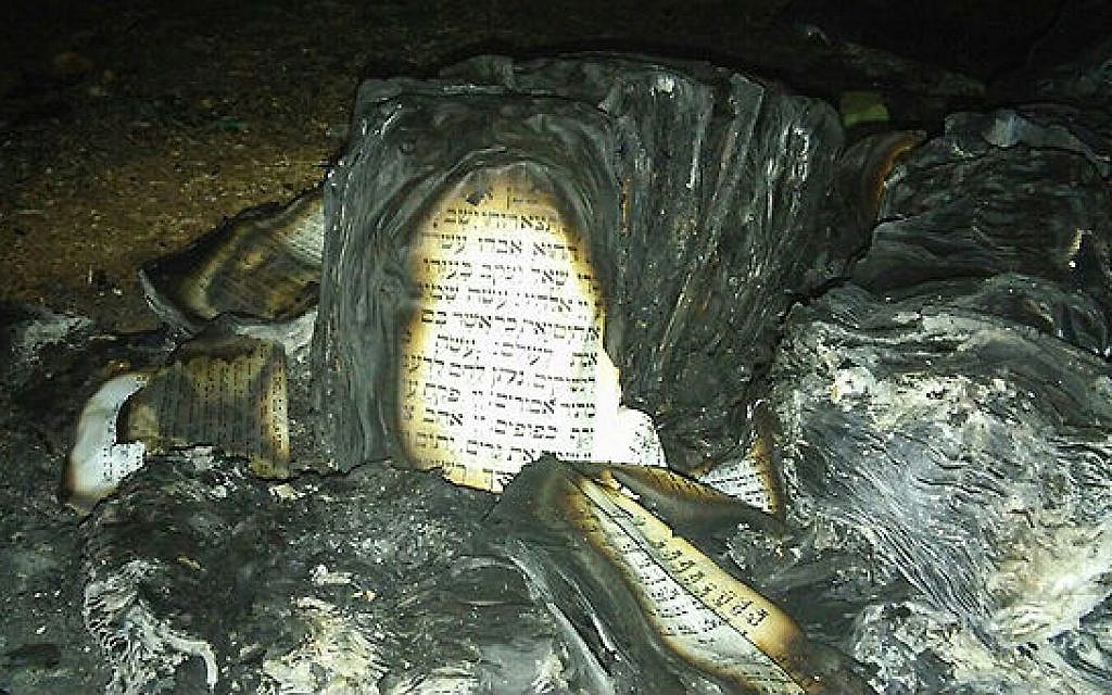 The remains of Torah scrolls set alight at the Givat Sorek outpost in the West Bank on February 6, 2016 (Courtesy: Karmei Tzur security department) The remains of Torah scrolls set alight at the Givat Sorek outpost in the West Bank on February 6, 2016 (Courtesy: Karmei Tzur security department)