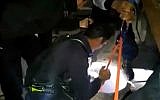 Beit Shemesh firefighters rescue a 17-year-old would-be thief trapped in a store's chimney during a botched overnight robbery, February 4, 2016. (Screen capture/Beit Shemesh Fire and Rescue Services)