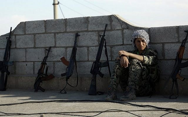 A fighter from the Syrian Democratic Forces (SDF) rests on a rooftop on the outskirts of the town of al-Shadadi in the northeastern Syrian province of Hasakeh, on February 19, 2016. (AFP / Delil Souleiman) A fighter from the Syrian Democratic Forces (SDF) rests on a rooftop on the outskirts of the town of al-Shadadi in the northeastern Syrian province of Hasakeh, on February 19, 2016. (AFP / Delil Souleiman)