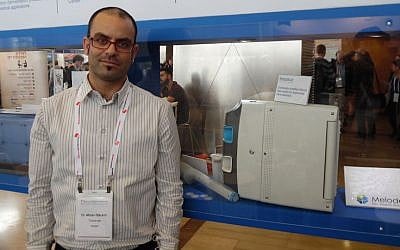 Matan Barami standing next to a Tracense system. (Courtesy)
