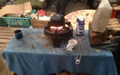 A burnt kettle in the Sudanese tent at the Calais refugee camp, providing hot water and sugar drinks for the residents, February 8, 2015. (Jenni Frazer/The Times of Israel)