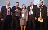 (L to R) Shlomo Gradman stands next to Ofir Akunis as he presents the Innovex Disrupt Award to Irina Kavounovski, Dr. John Abeles, and Igor Waysbey of Vigor Medical Technologies, February 3, 2016 (Courtesy)