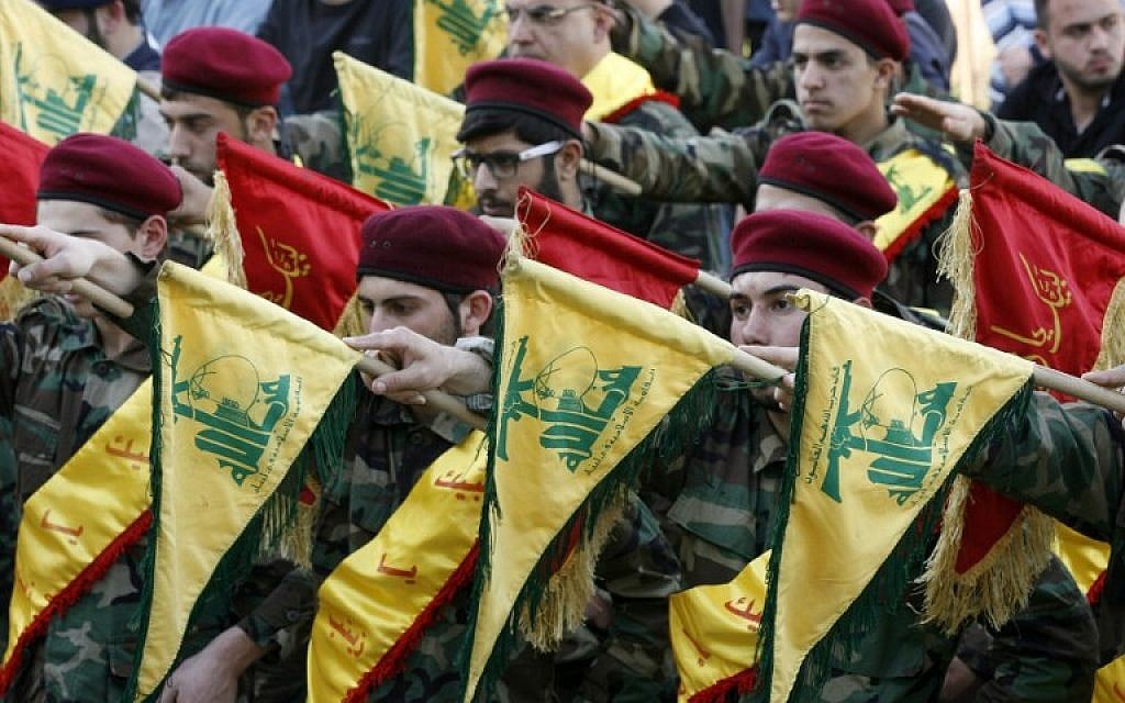 Members of Lebanon's Shiite Hezbollah hold their flags during the funeral of a Hezbollah fighter, who was killed while fighting alongside Syrian government forces in Syria, March 1, 2016. (AFP/Mahmoud Zayyat) Members of Lebanon's Shiite Hezbollah hold their flags during the funeral of a Hezbollah fighter, who was killed while fighting alongside Syrian government forces in Syria, March 1, 2016. (AFP/Mahmoud Zayyat)