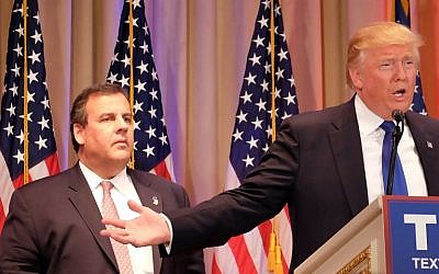 New Jersey Governor and former White House hopeful Chris Christie (left) listens as Republican presidential candidate Donald Trump (right) speaks to the media in Palm Beach, Florida, March 1, 2016. (AFP/Gaston De Cardenas)