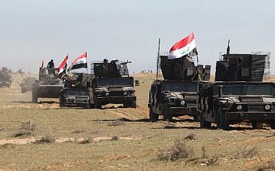 Iraqi Anti-terror forces drive down a road, in the desert of Samarra, on March 2, 2016, during an operation aimed at retaking areas from the Islamic State (IS) jihadist group. (AFP / AHMAD AL-RUBAYE)