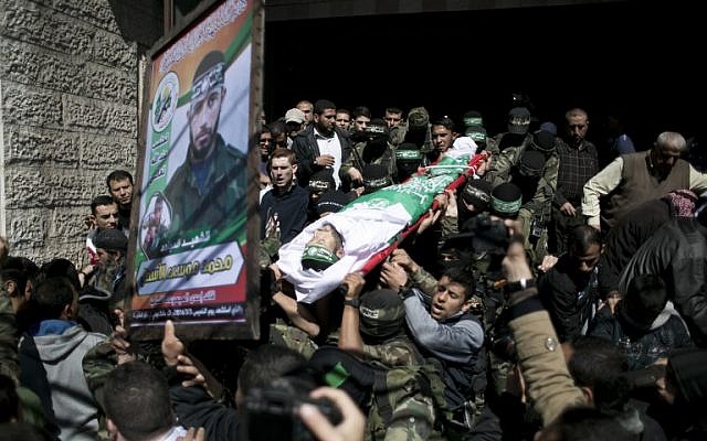 Illustrative: Members of Hamas terror group carry the body of Mohamed al-Astal, killed in a tunnel collapse, during his funeral in Khan Yunis in the southern Gaza Strip on March 4, 2016. (AFP / SAID KHATIB) Illustrative: Members of Hamas terror group carry the body of Mohamed al-Astal, killed in a tunnel collapse, during his funeral in Khan Yunis in the southern Gaza Strip on March 4, 2016. (AFP / SAID KHATIB)