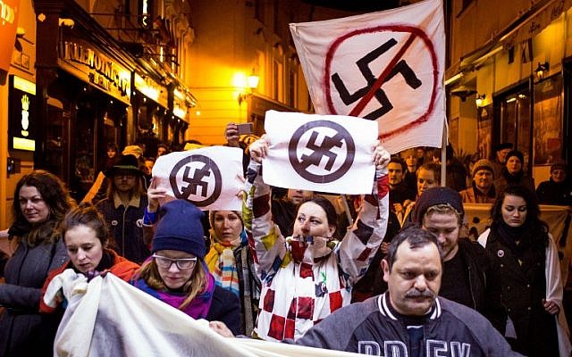 People take part in an anti extreme right rally in reaction to results of parliamentary elections in Bratislava on March 7, 2016. The neo-Nazi People's Party Our Slovakia (LSNS) led by Marian Kotleba gained 8 percent of the votes. (AFP / VLADIMIR SIMICEK) People take part in an anti extreme right rally in reaction to results of parliamentary elections in Bratislava on March 7, 2016. The neo-Nazi People's Party Our Slovakia (LSNS) led by Marian Kotleba gained 8 percent of the votes. (AFP / VLADIMIR SIMICEK)